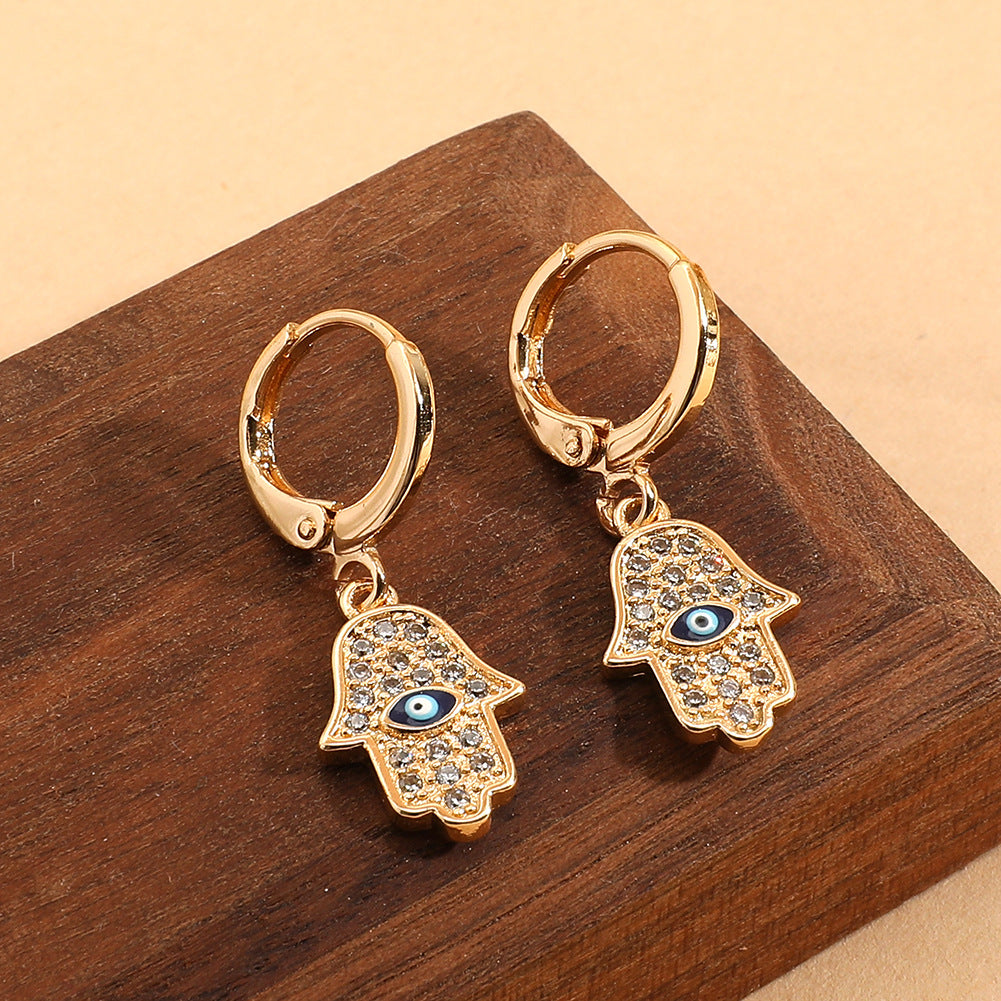 Pendientes al por mayor de caídas de ojales con ojo de aceite